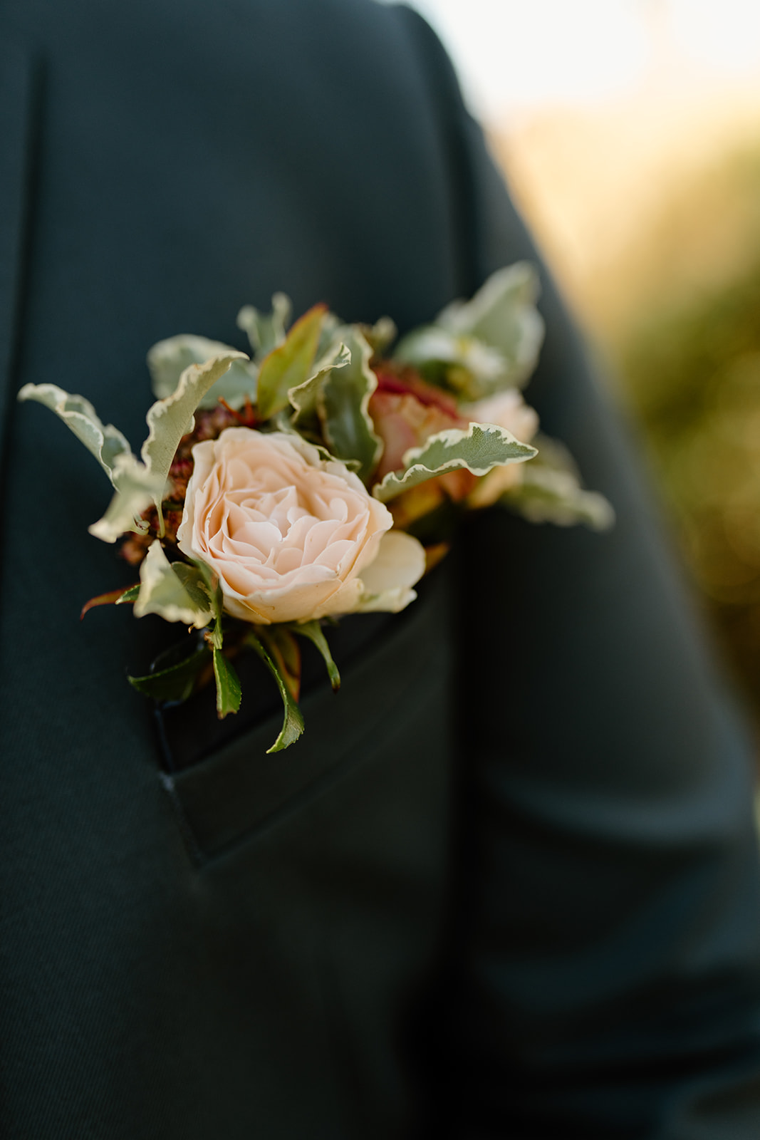 Boutonniere on groom at The White Barn in San Luis Obispo CA, photography by Cobblestone
