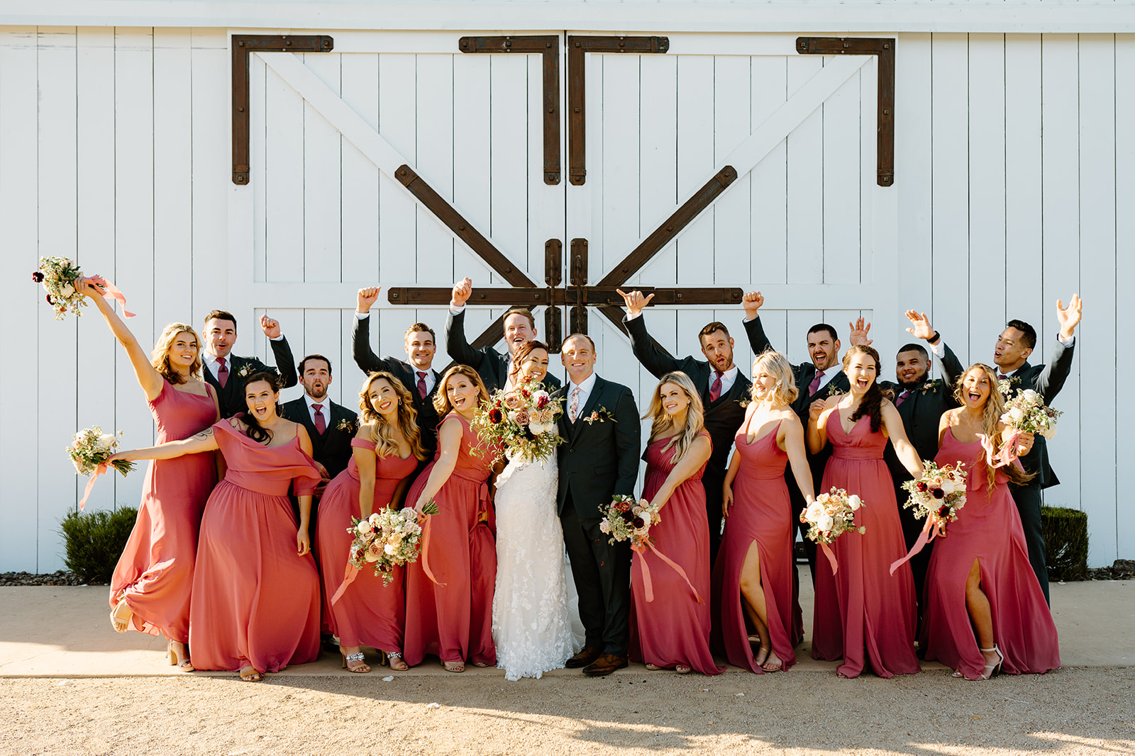 Bridal Party cheers at The White Barn in San Luis Obispo CA, photography by Cobblestone