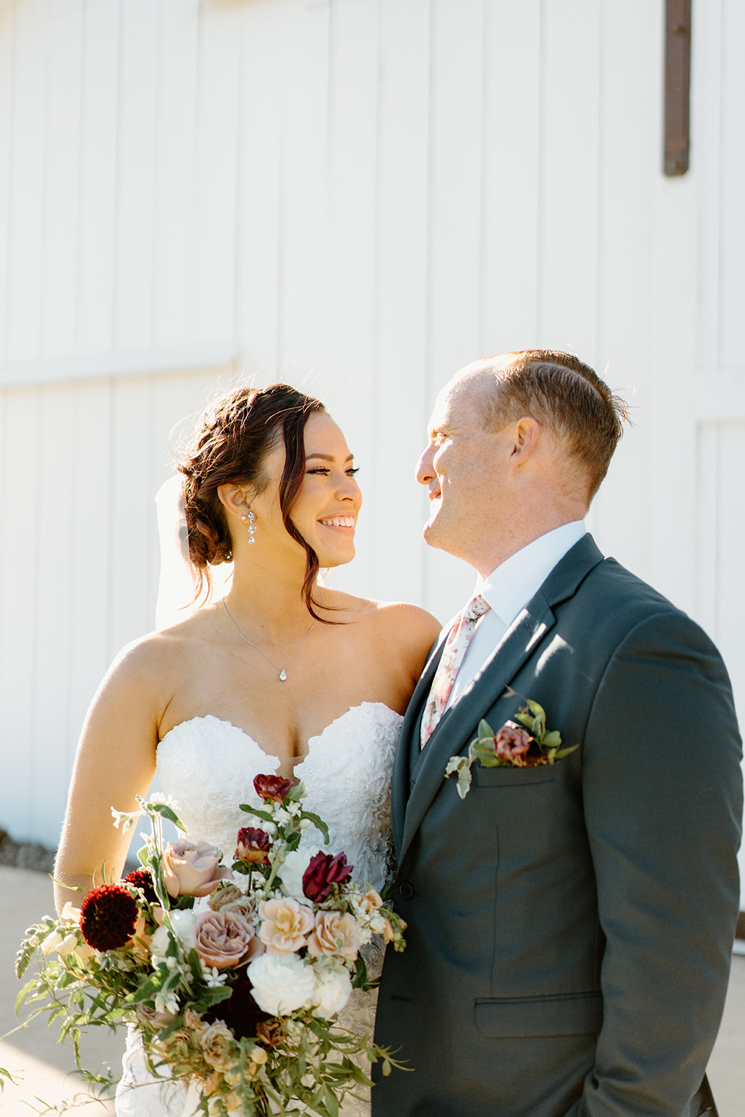 Bride and groom look into each others eyes at The White Barn in San Luis Obispo CA, photography by Cobblestone