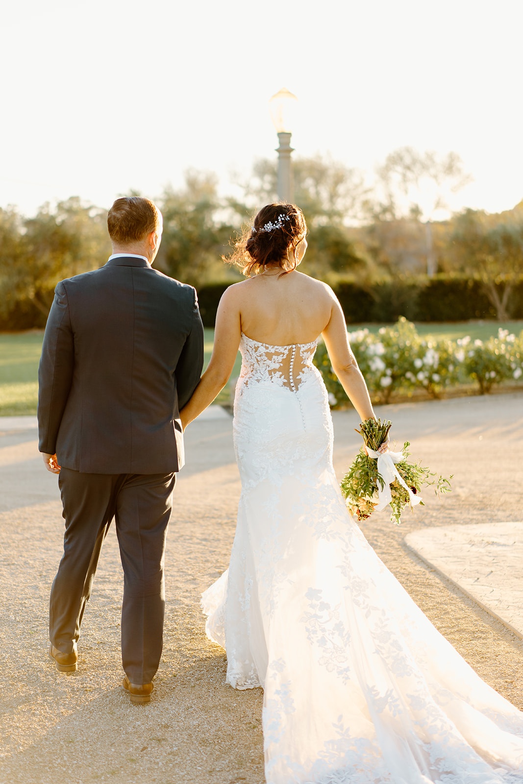 Bride and groom walk the grounds at The White Barn in San Luis Obispo CA, photography by Cobblestone