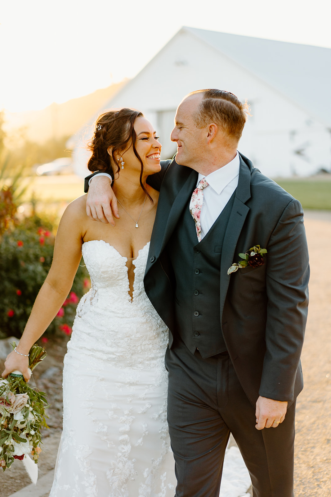 bride and groom look longingly at each other at The White Barn in San Luis Obispo CA, photography by Cobblestone