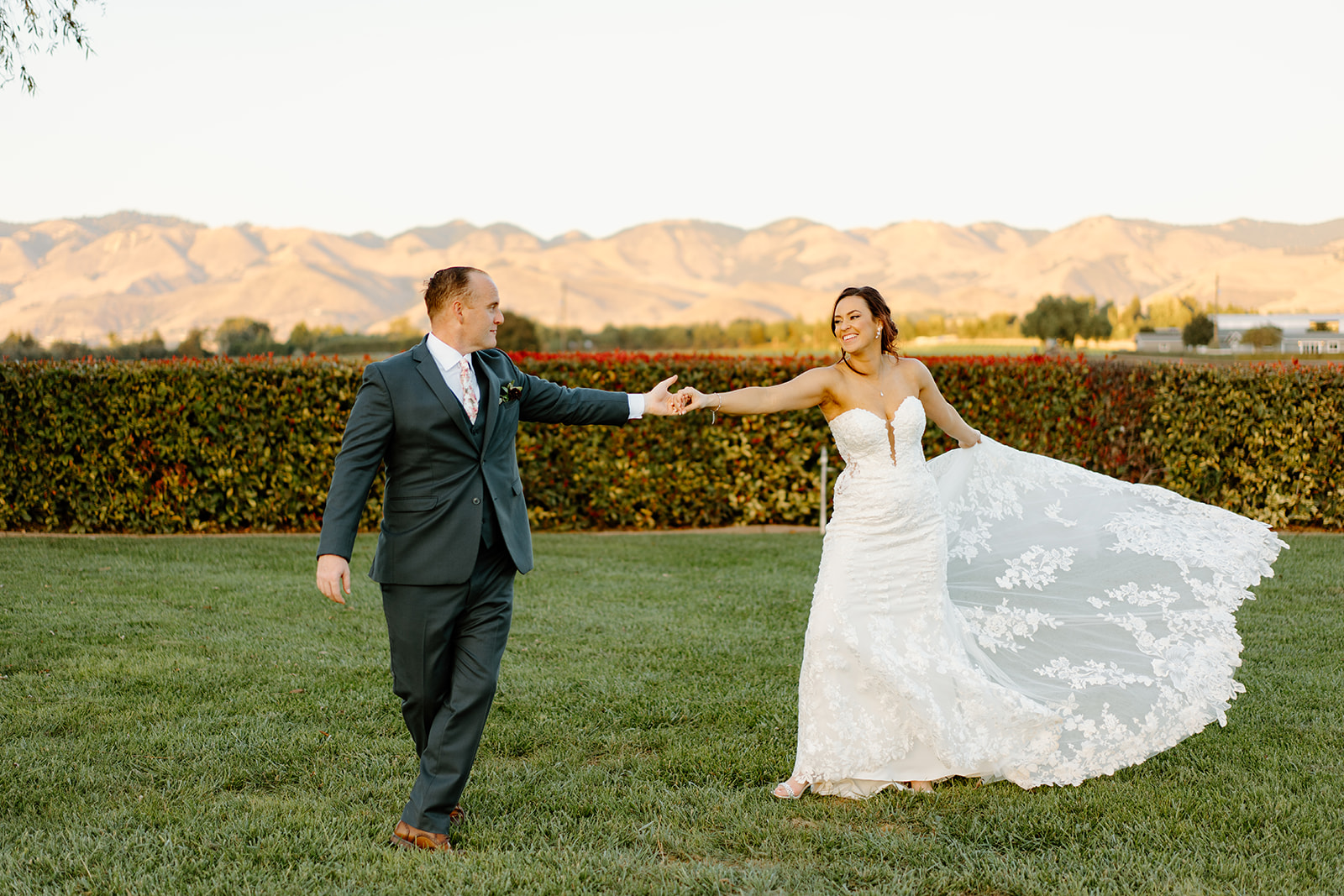 Bride spins her dress at The White Barn in San Luis Obispo CA, photography by Cobblestone