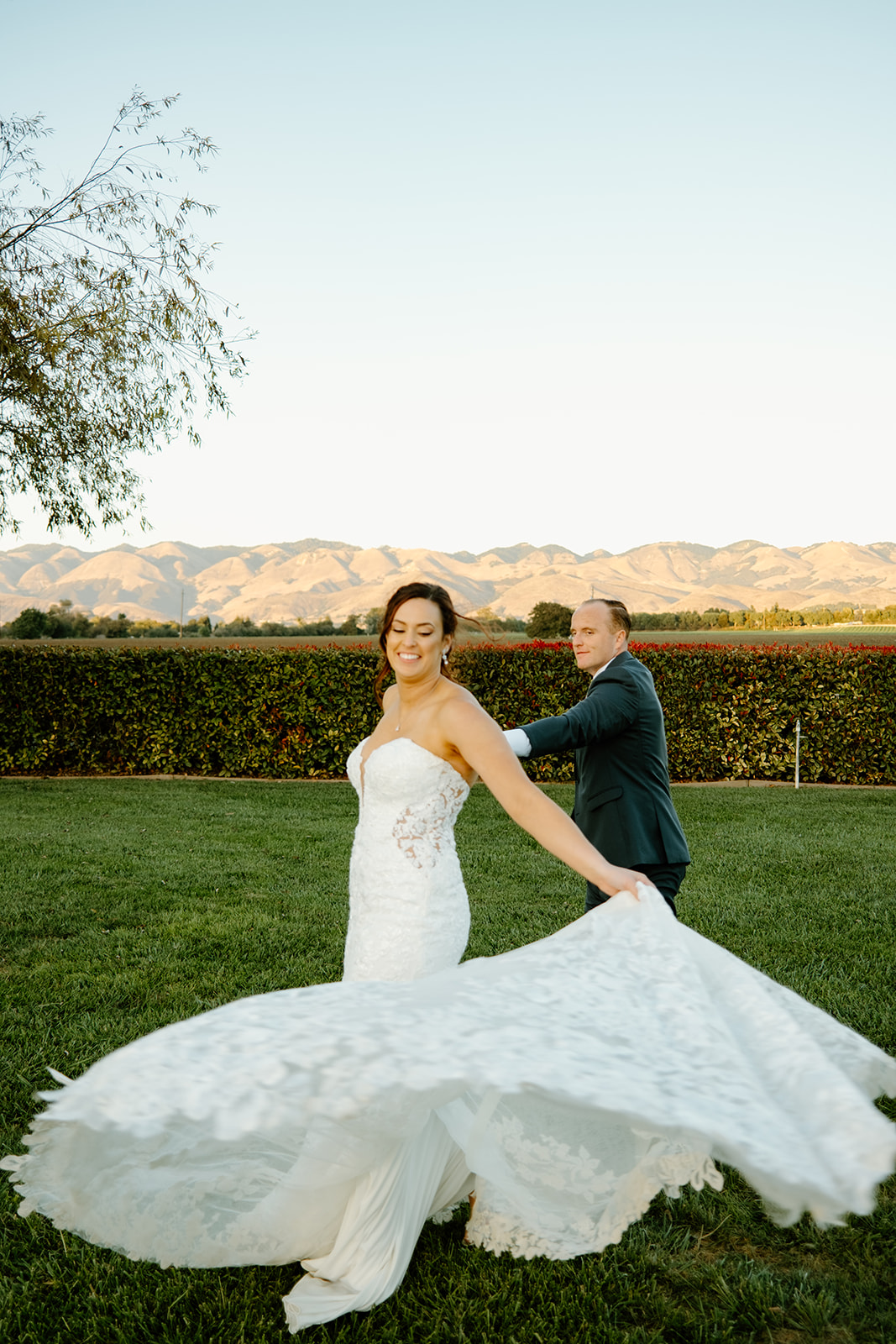 Bride spins her dress at The White Barn in San Luis Obispo CA, photography by Cobblestone
